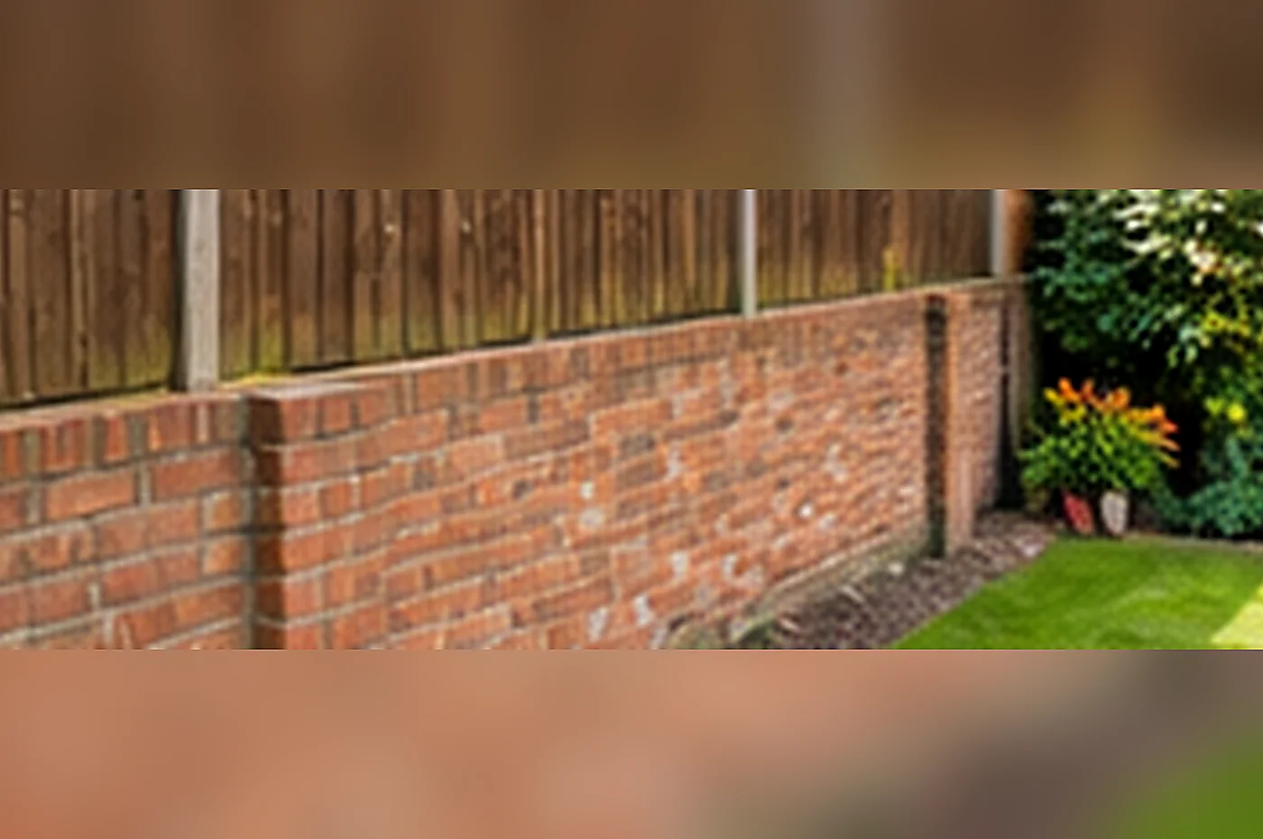 party fence wall - low brick garden wall marking the boundary between neighbouring gardens